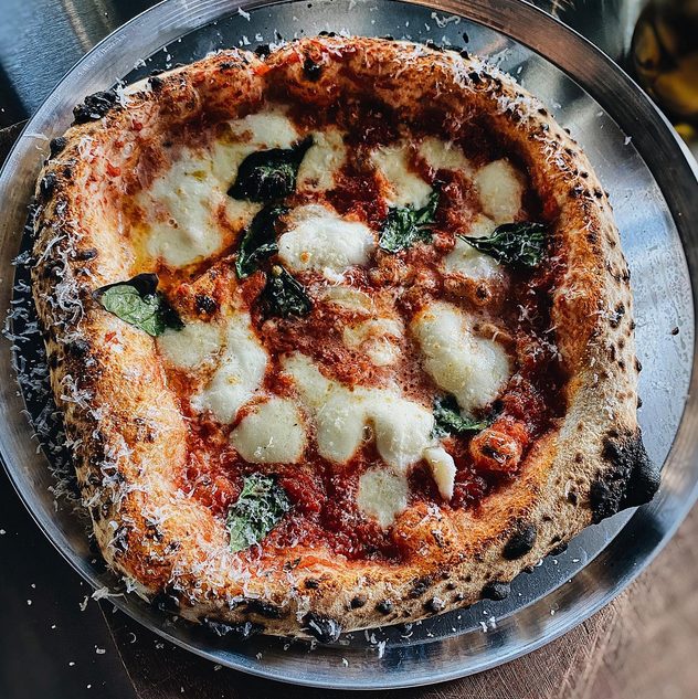 Traditional wood-fired Neapolitan pizza via Hometown Pizza